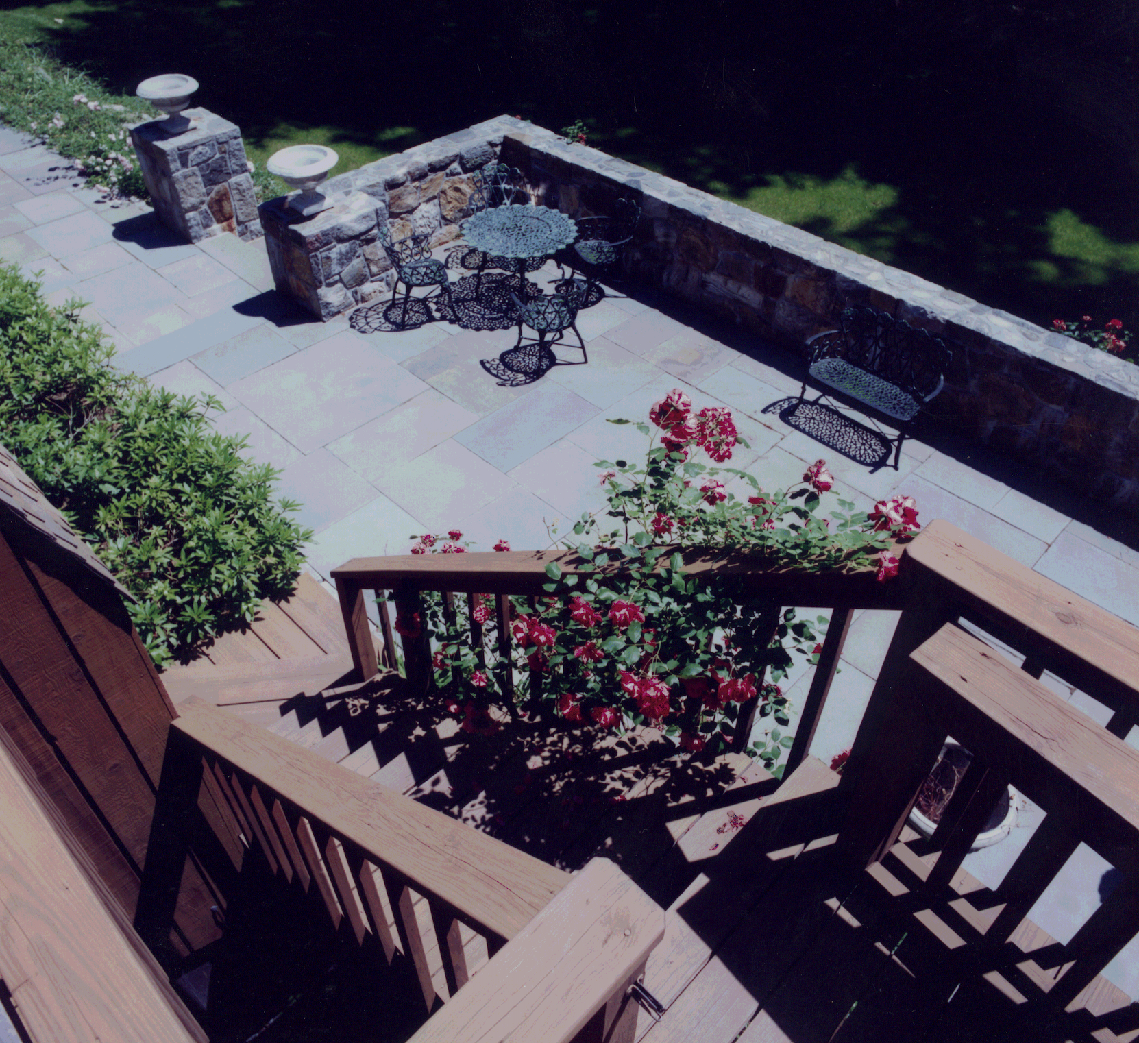 An aerial view of a patio with a table and chairs