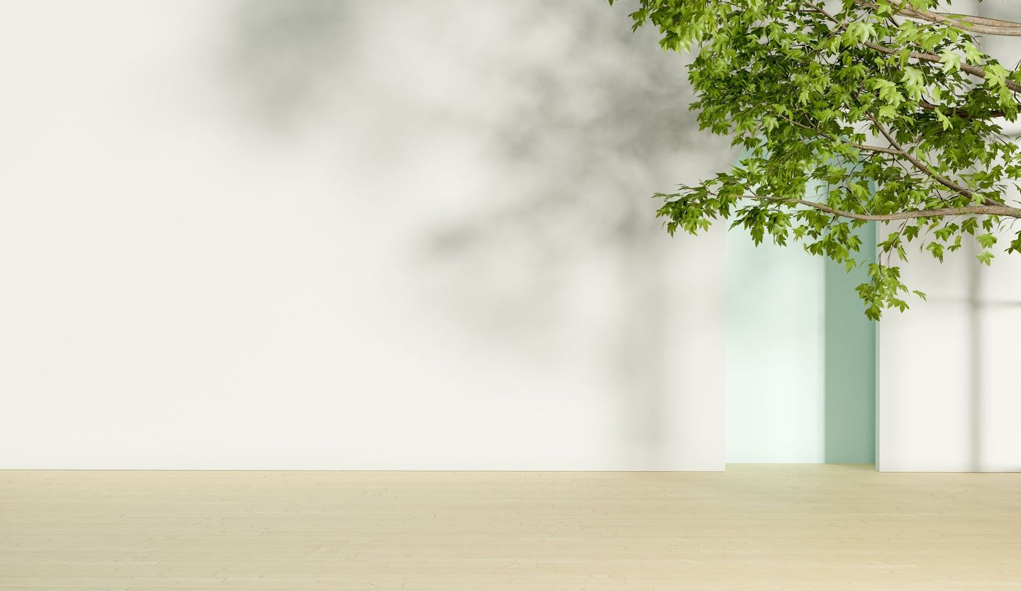 A wooden table with a tree branch hanging over it.