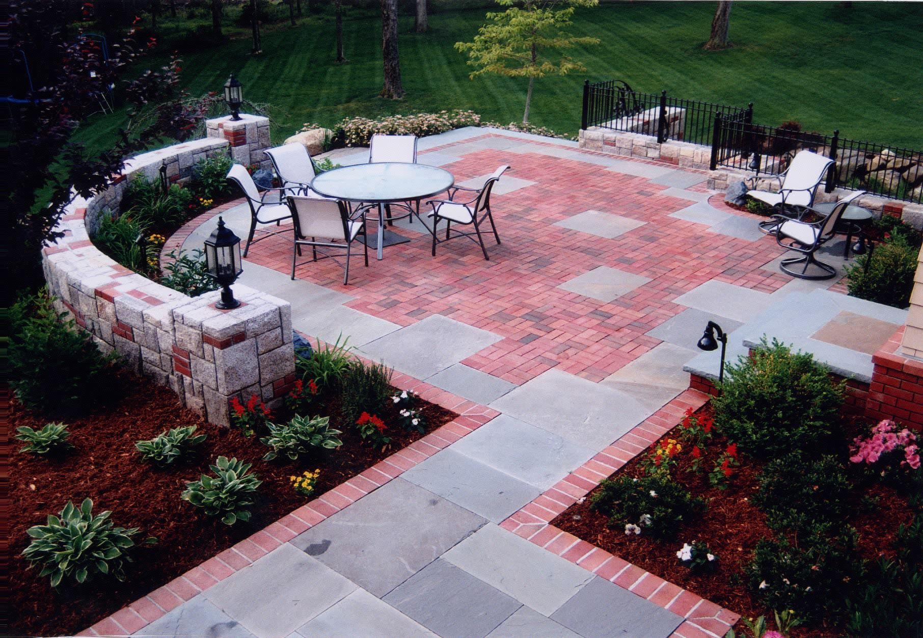 A patio with a table and chairs on it