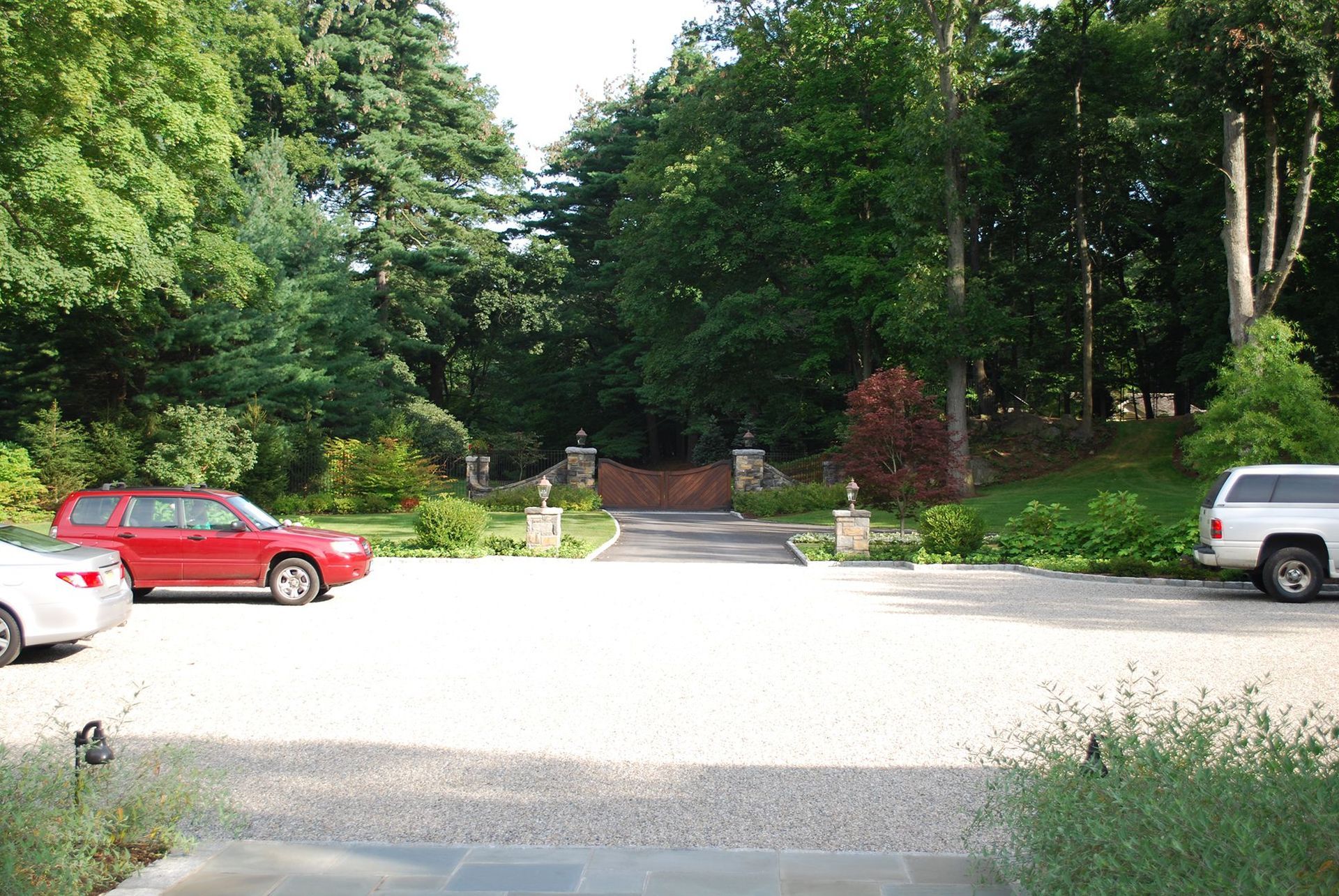 A red car is parked in a parking lot