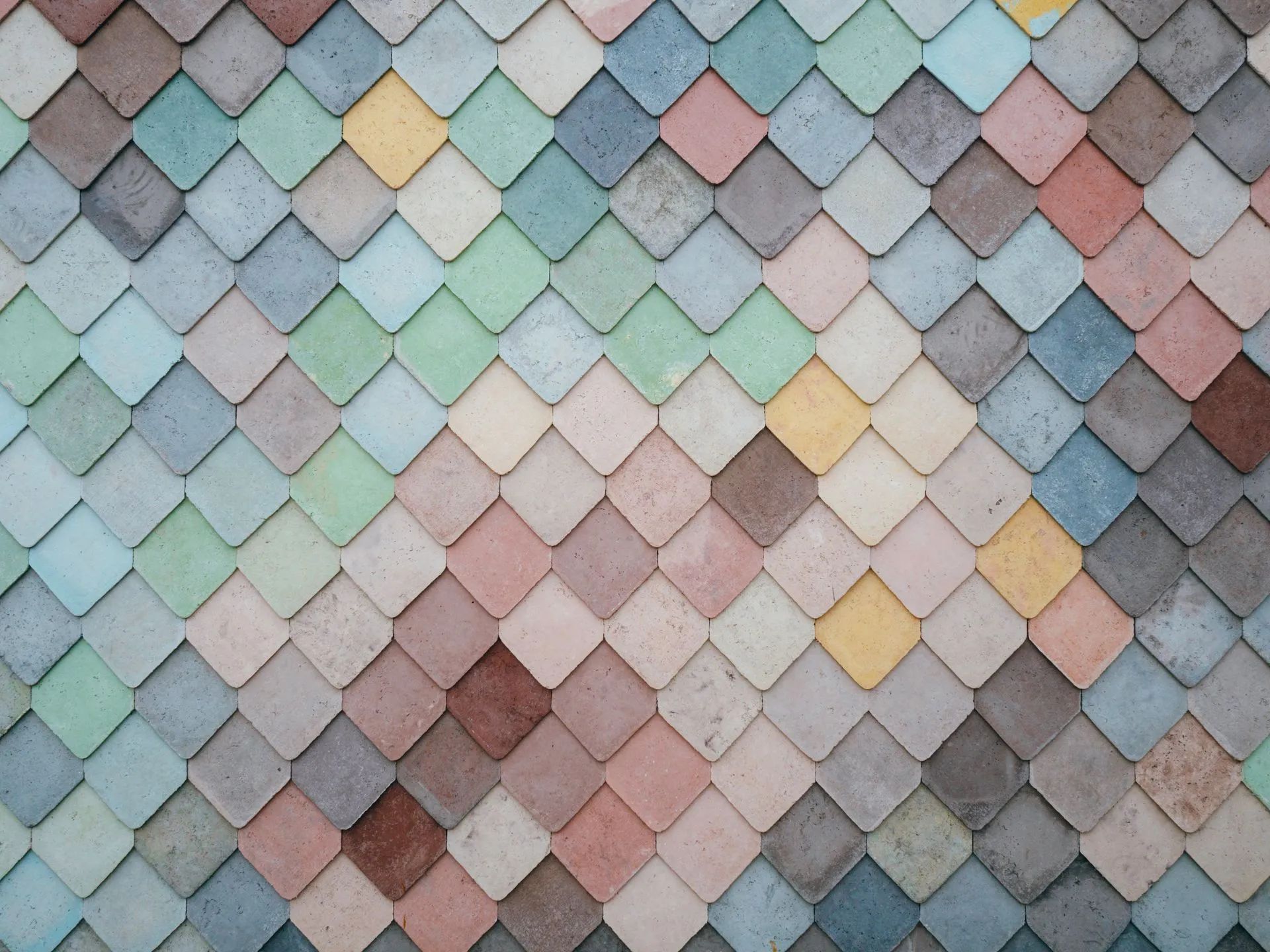 A close up of a colorful tile wall.