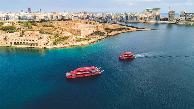 The new Malta ferries built by Wight Shipyard cruising through the picturesque city of Valletta