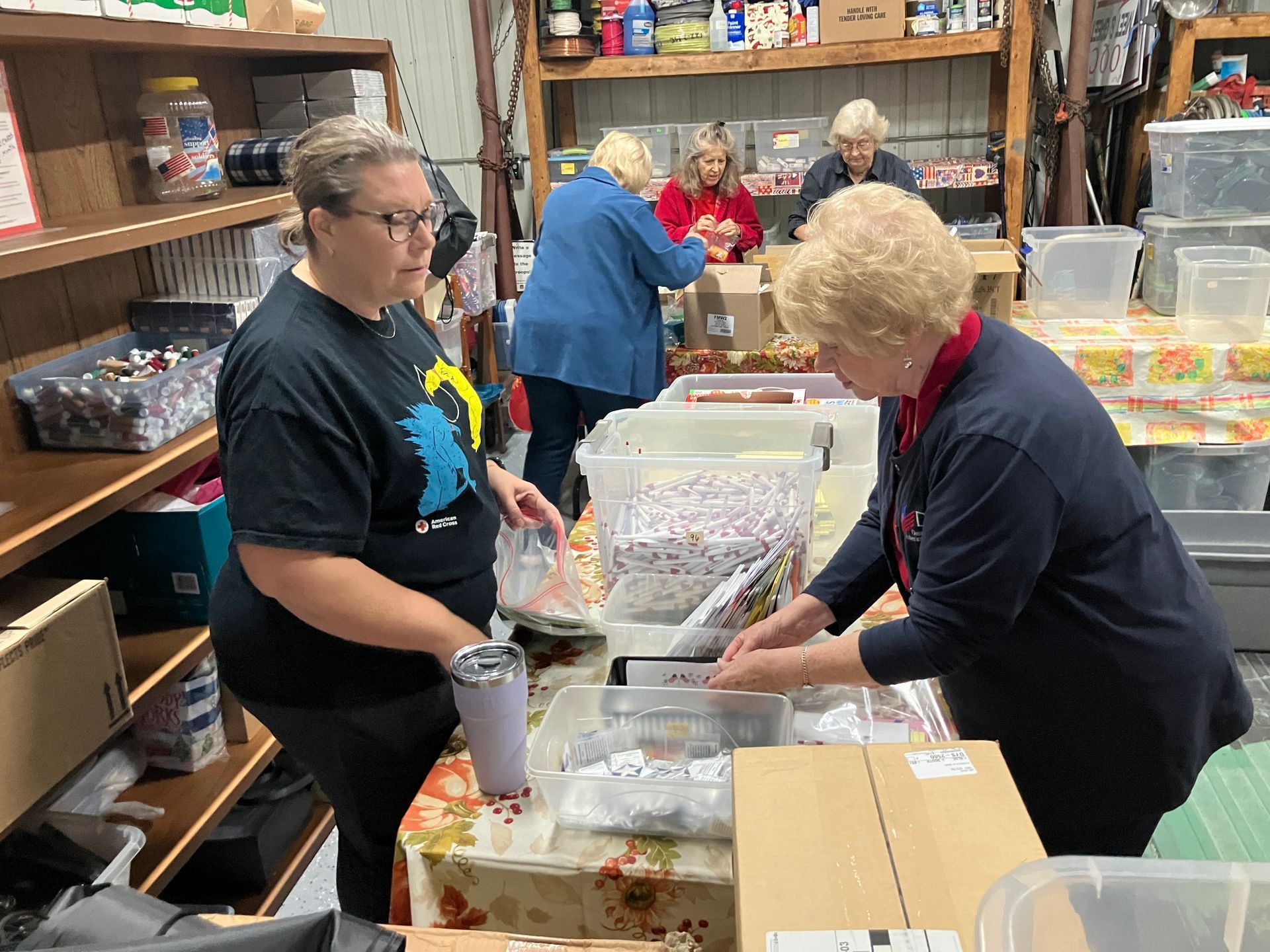 Man and woman hold wooden American flag