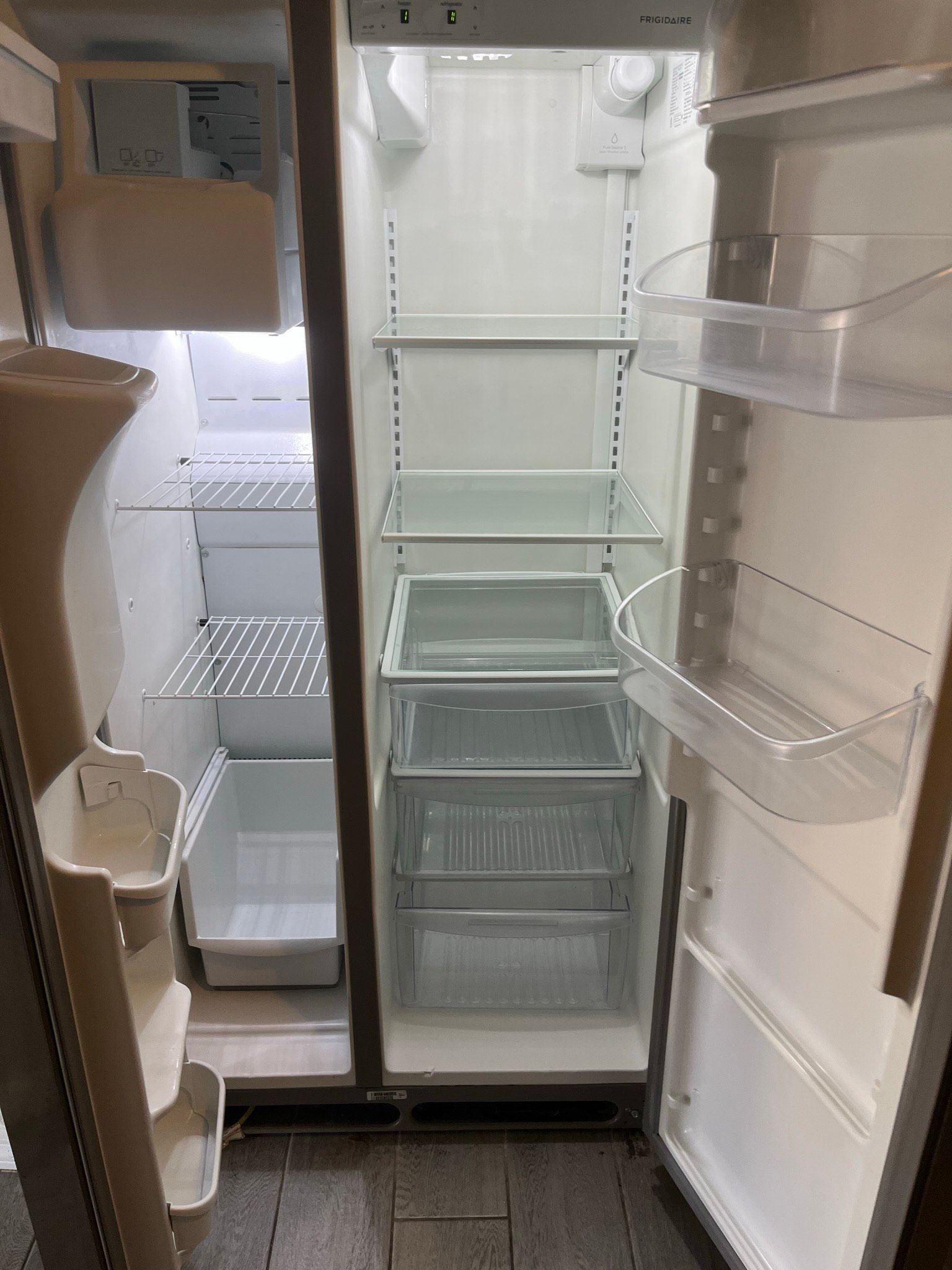 the inside of an empty refrigerator with the door open . | Litchfield Park, AZ | Cleaning Elite