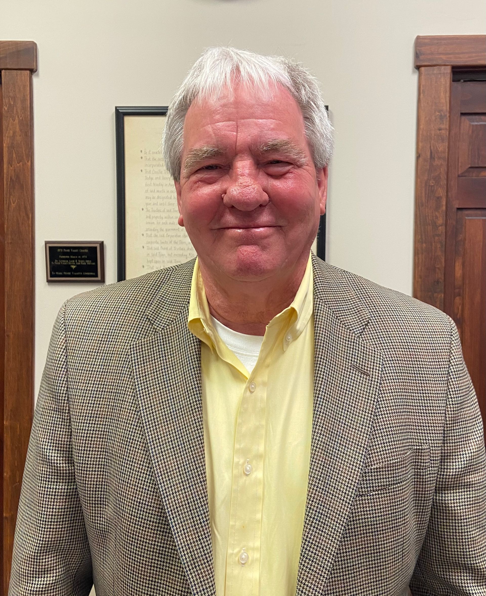 A black and white logo for pewee valley kentucky