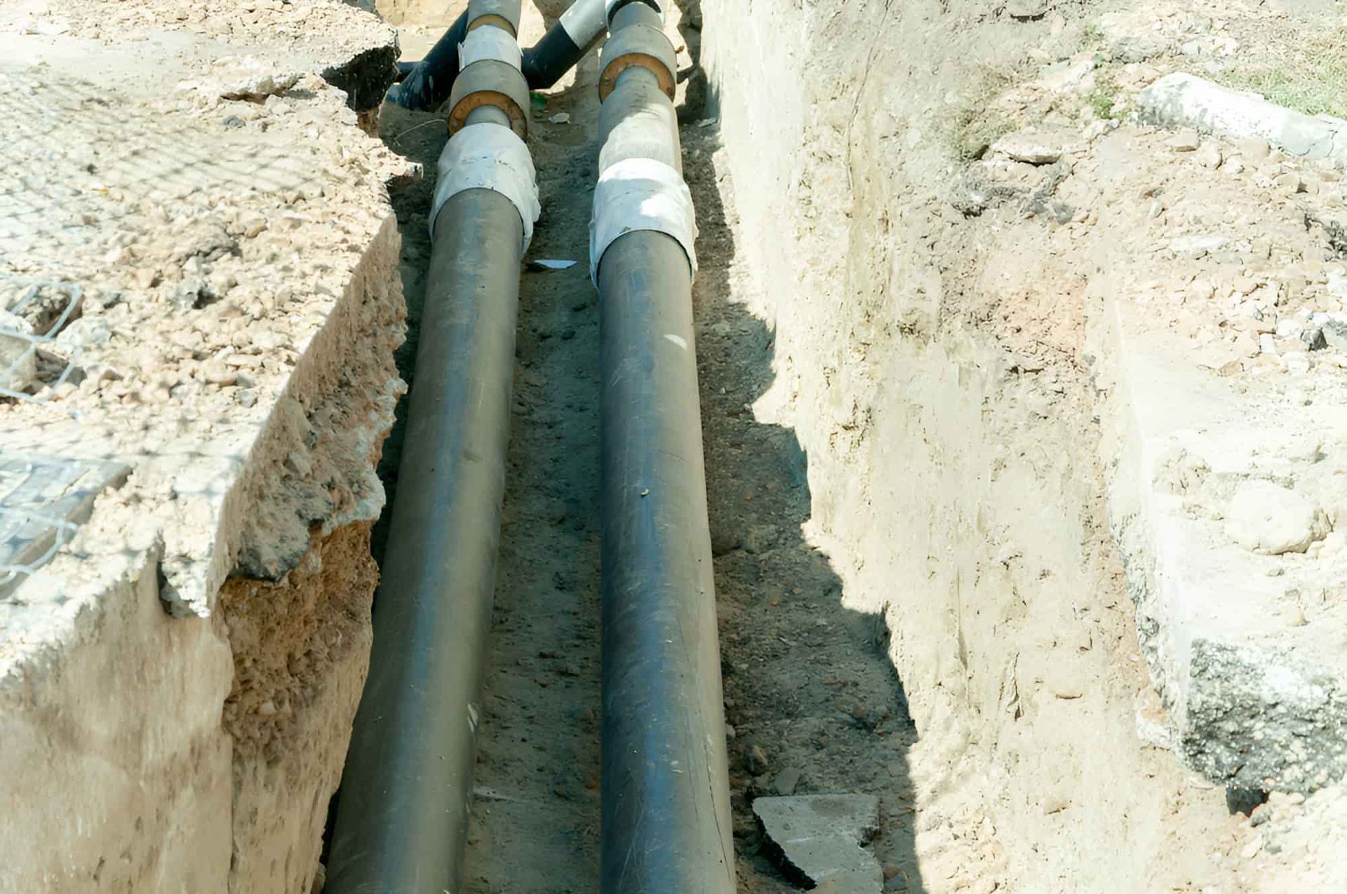 A Couple Of Pipes That Are Laying Underground — CQ Service Locating In Gladstone, QLD