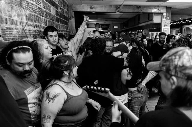 A black and white photo of a crowd of people