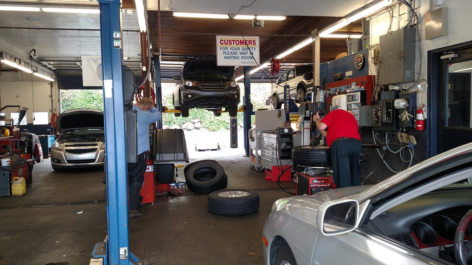 Vehicles inside of our garage at work in Seattle, WA | Masters Auto & Tire