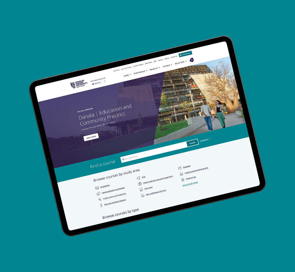 A tablet with a website on it is sitting on a blue surface.