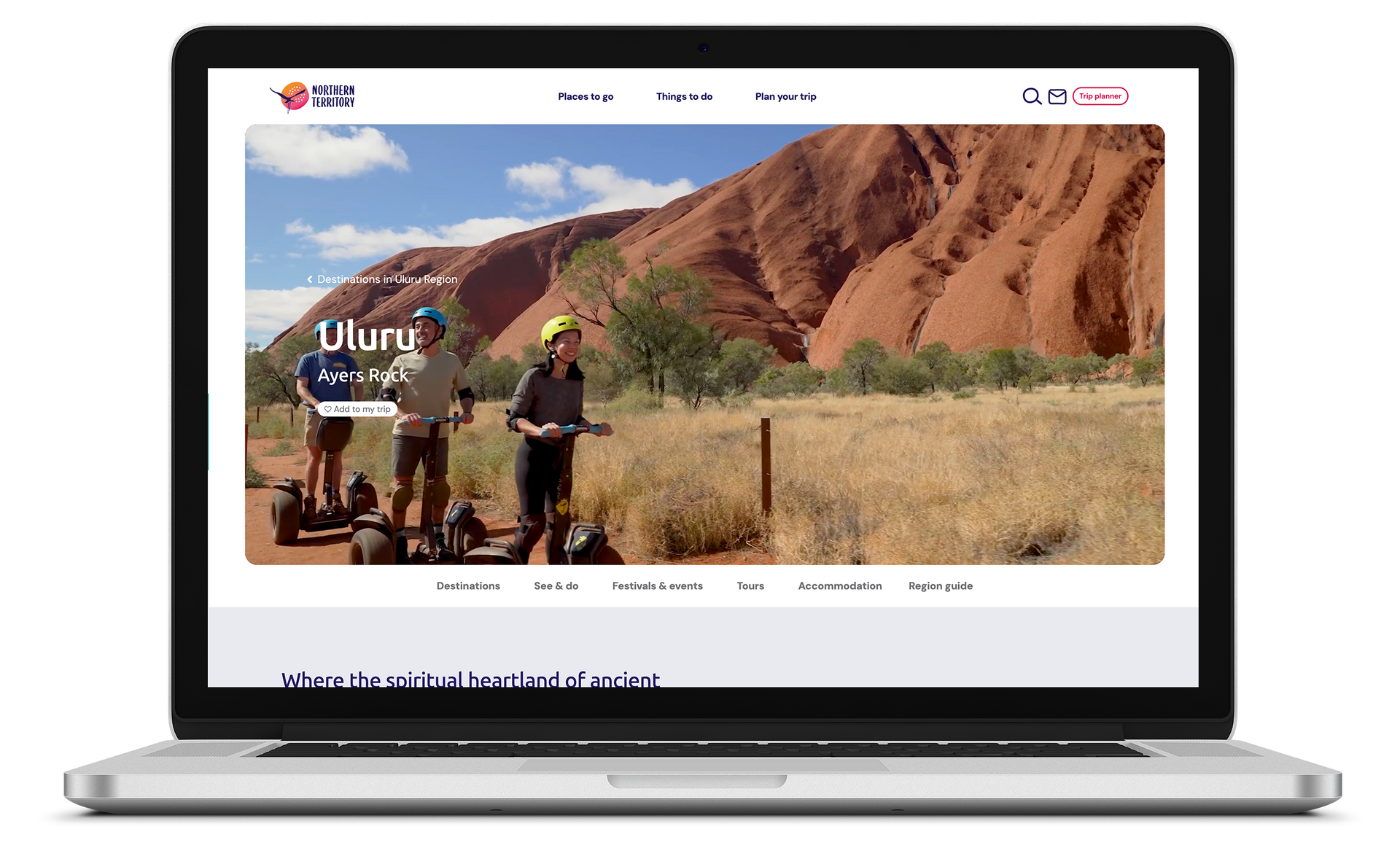 A laptop computer is open to a website showing people riding segways in the desert.