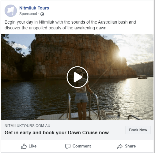 A woman is standing on a boat in the water.