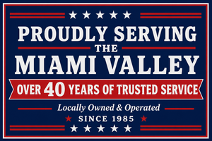 Blue sign reading “Proudly Serving Miami Valley” with “Over 40 Years of Trusted Service” and stars