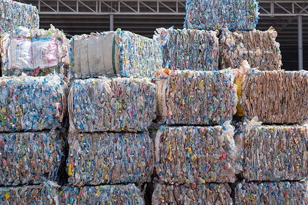 A pile of plastic bottles stacked on top of each other.