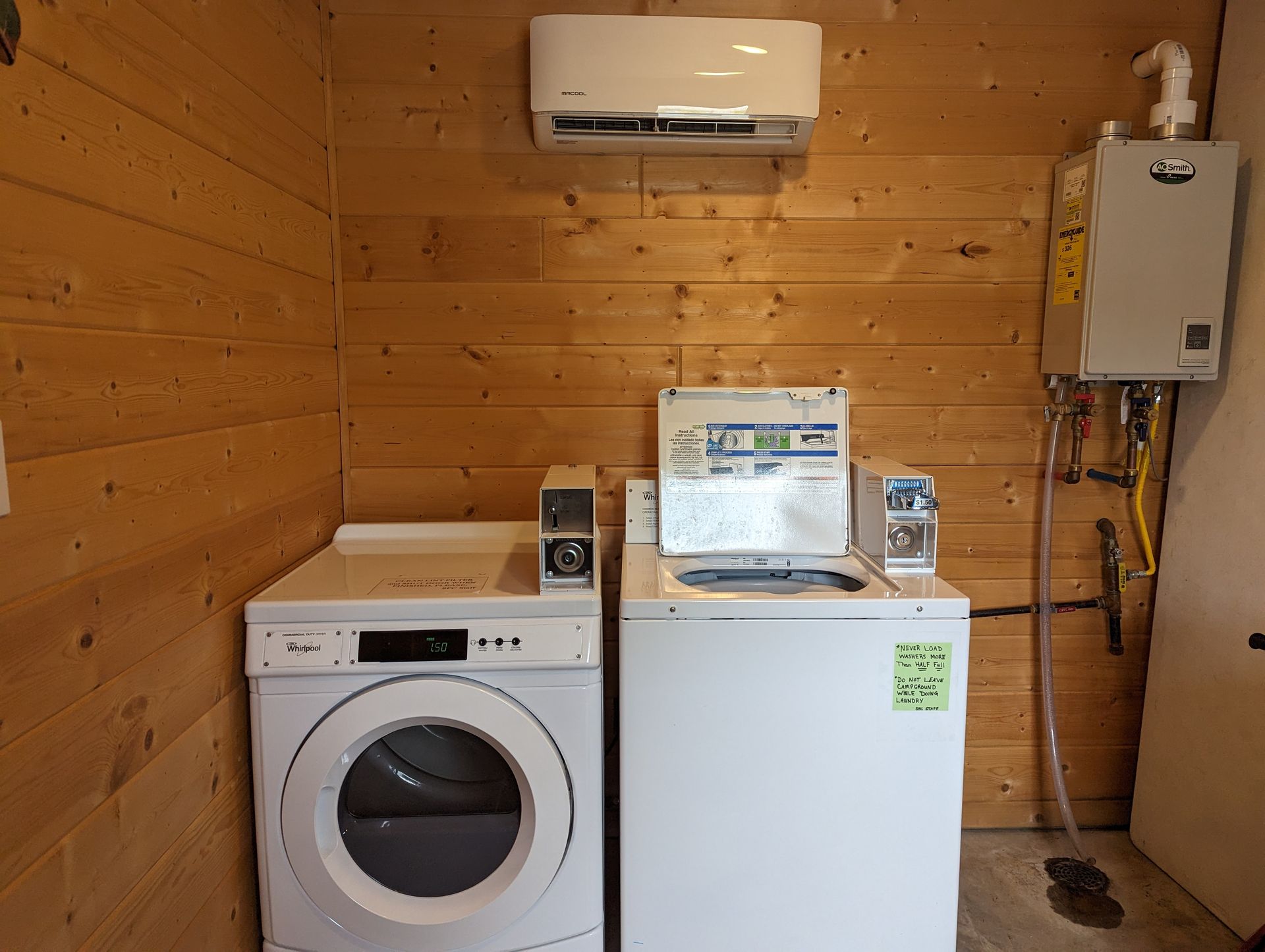 A tent is sitting on top of a hill at sunset