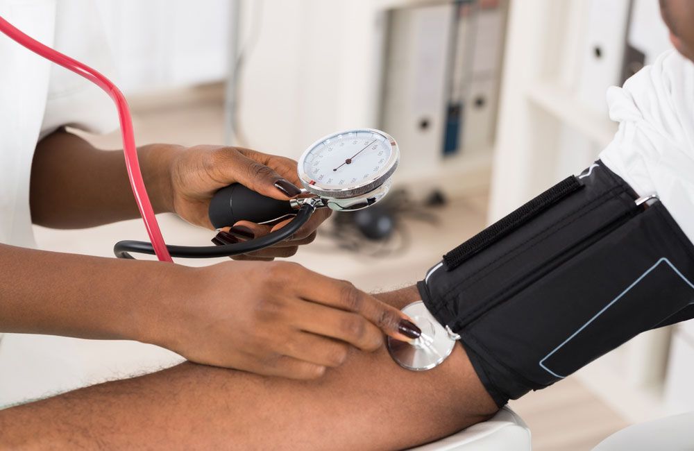 Doctor Checking Blood Pressure — Sugar Land, TX — Intouch Primary Care