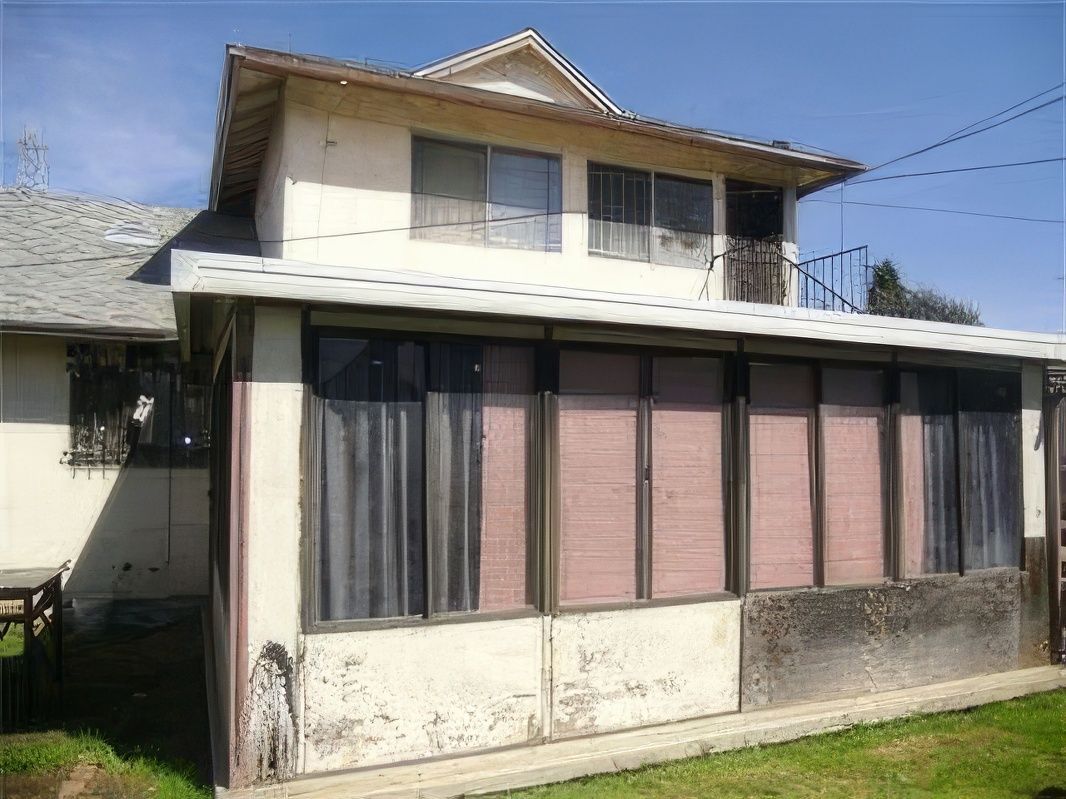 A house with a lot of windows and curtains on it