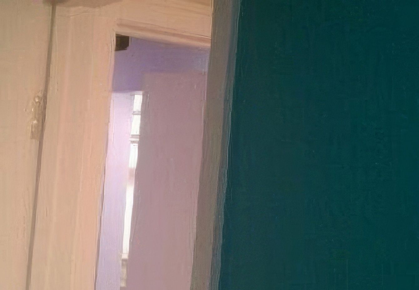 A doorway leading to a room with a blue wall.