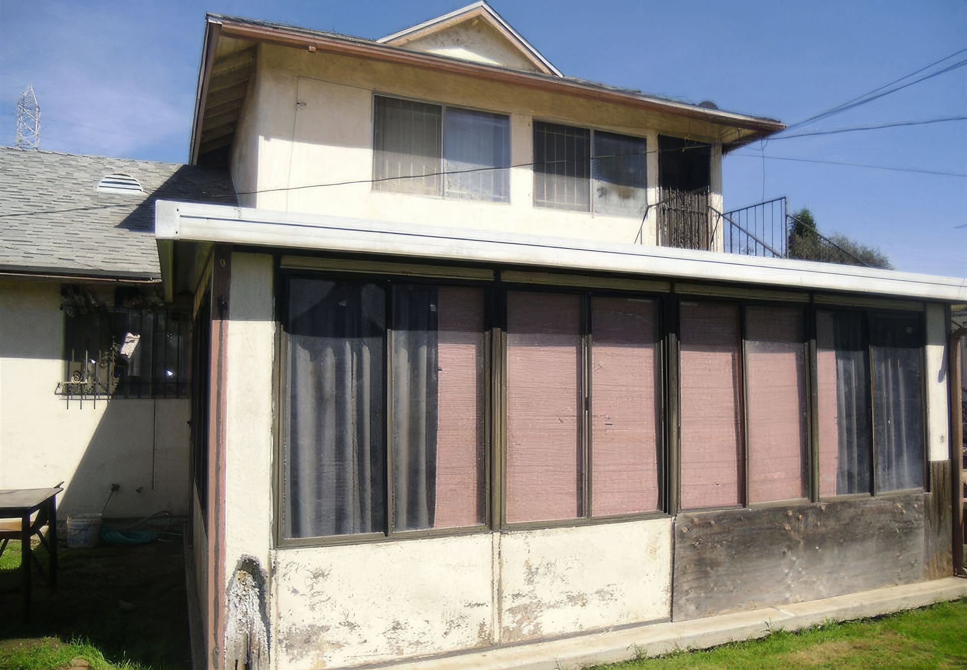 A house with a lot of windows and curtains