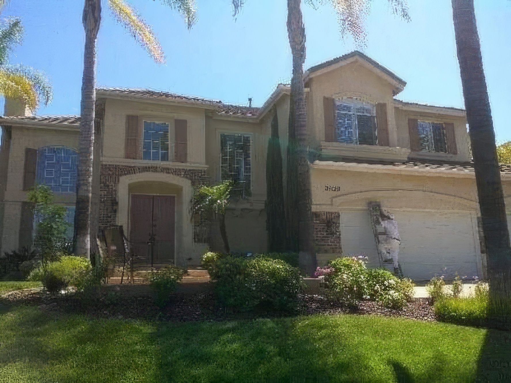 A large house with a man standing in front of it