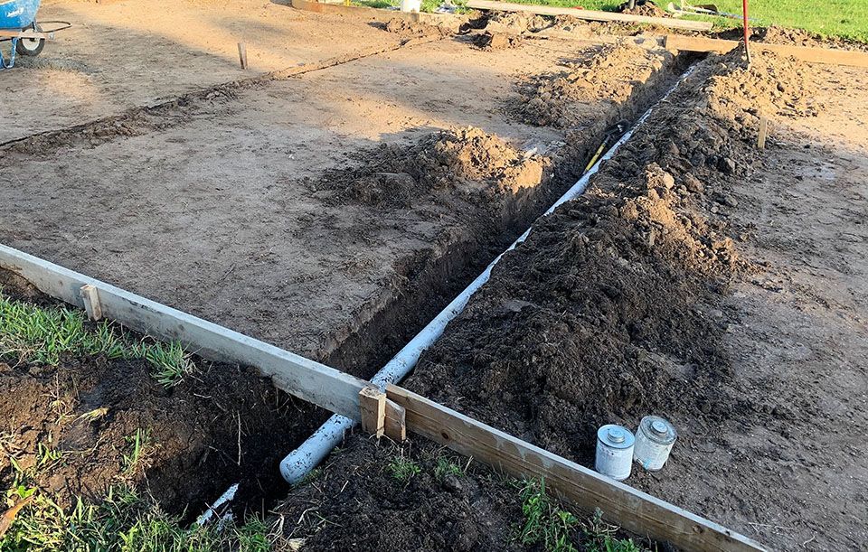 Residential irrigation sleeve underneath driveway