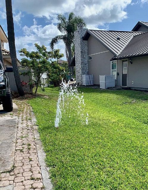 A geyser from a broken sprinkler head. Wasted water