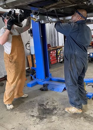 Mechanics at work under car | Mechanics of FAITH