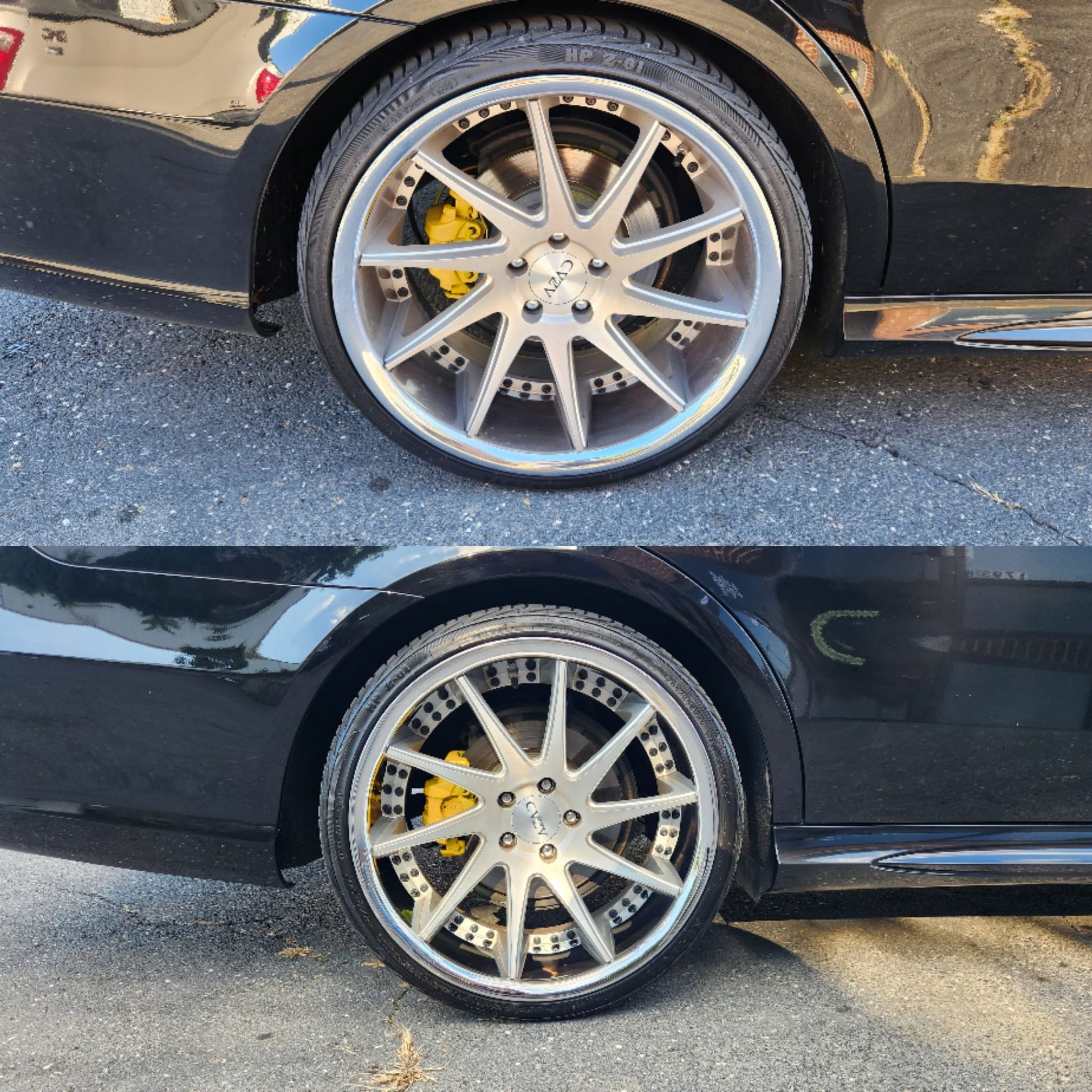 A black car with chrome wheels and yellow brake calipers
