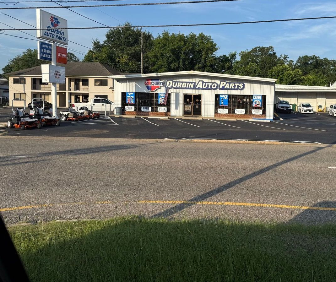 A white building with the word auto parts on it