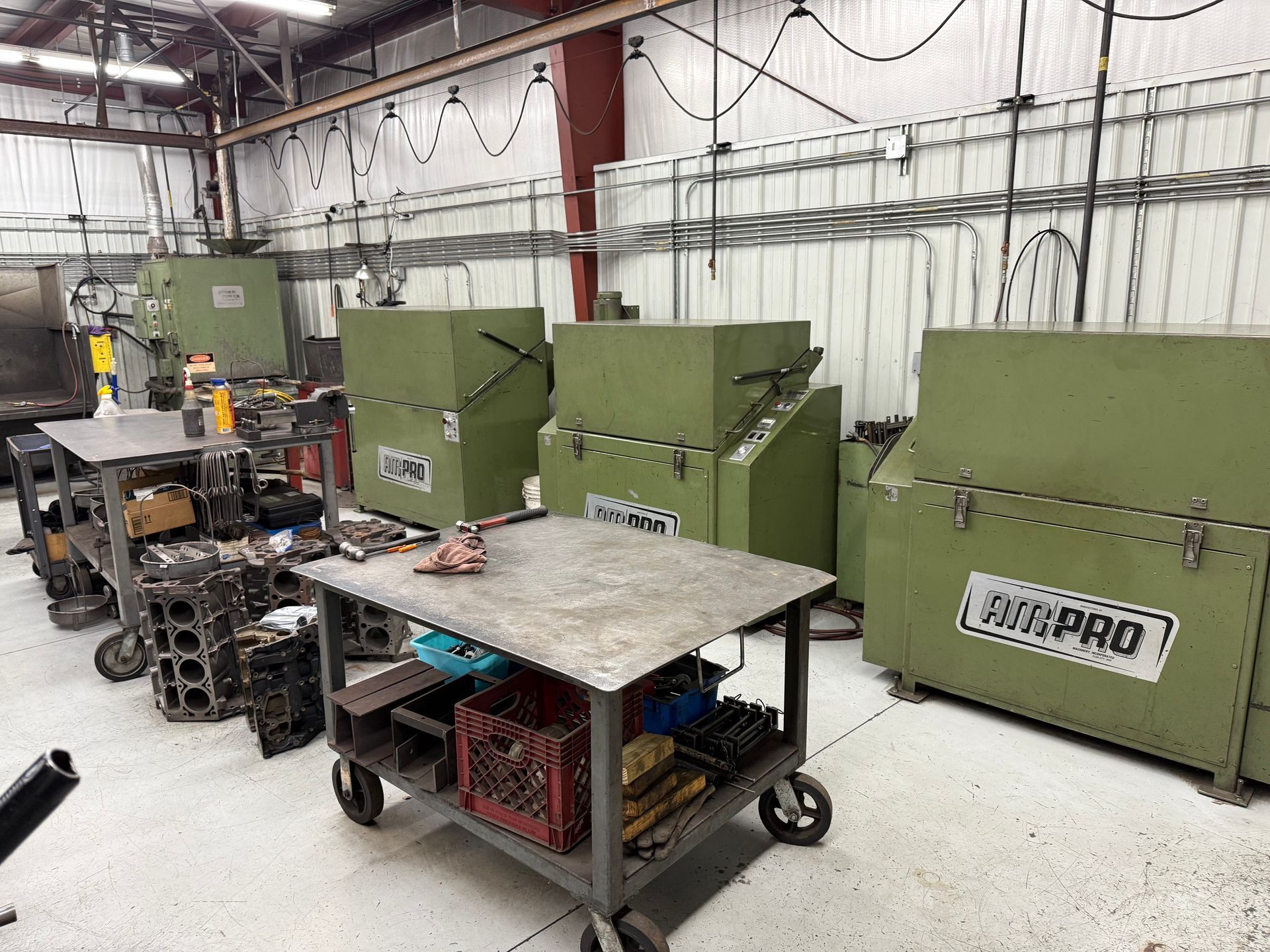 A factory with a lot of machinery and a table that says bushpro on it