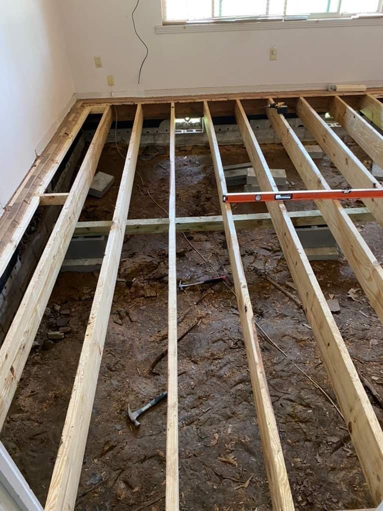 A wooden floor is being built in a room.