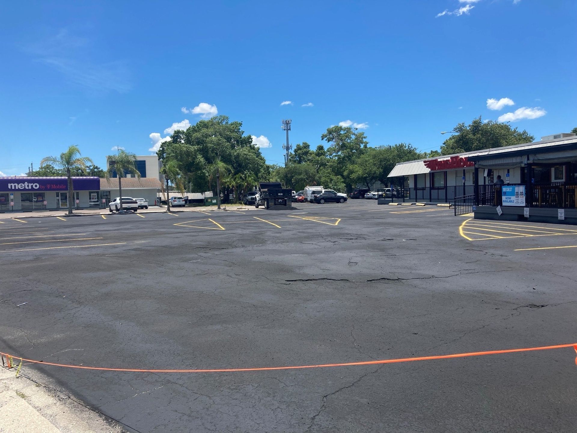 An empty parking lot in front of a store called extra