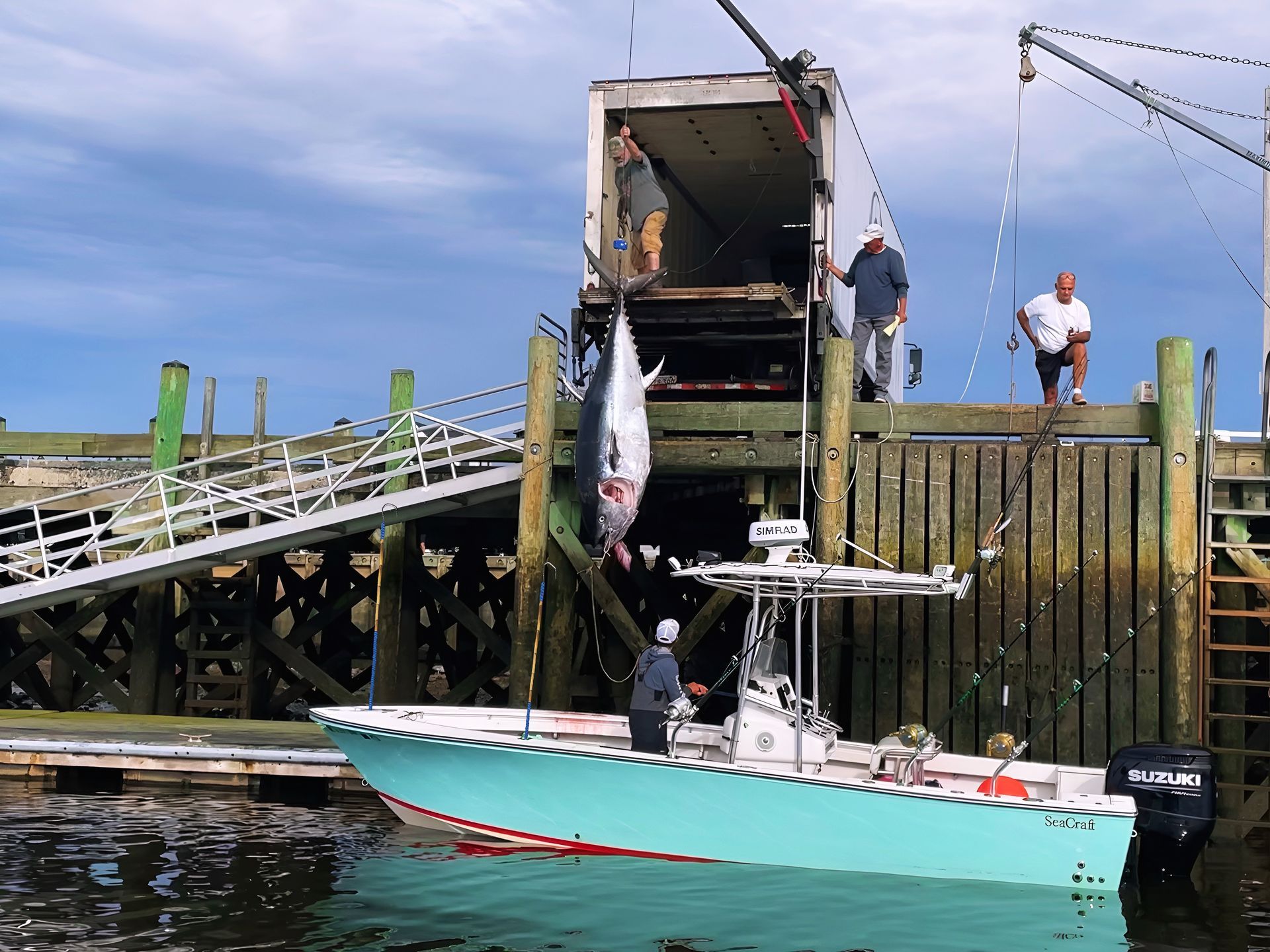 A suzuki boat is docked at a dock