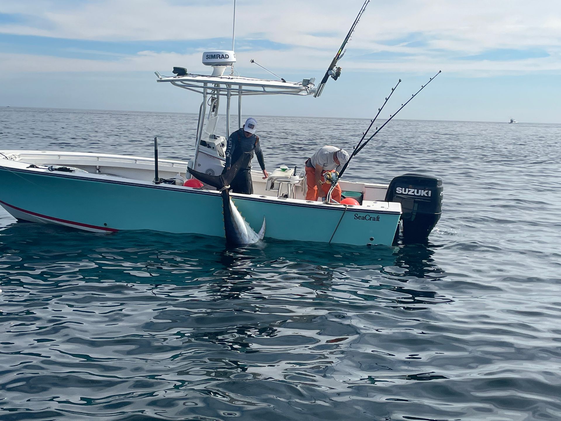 A boat with the word suzuki on the side of it