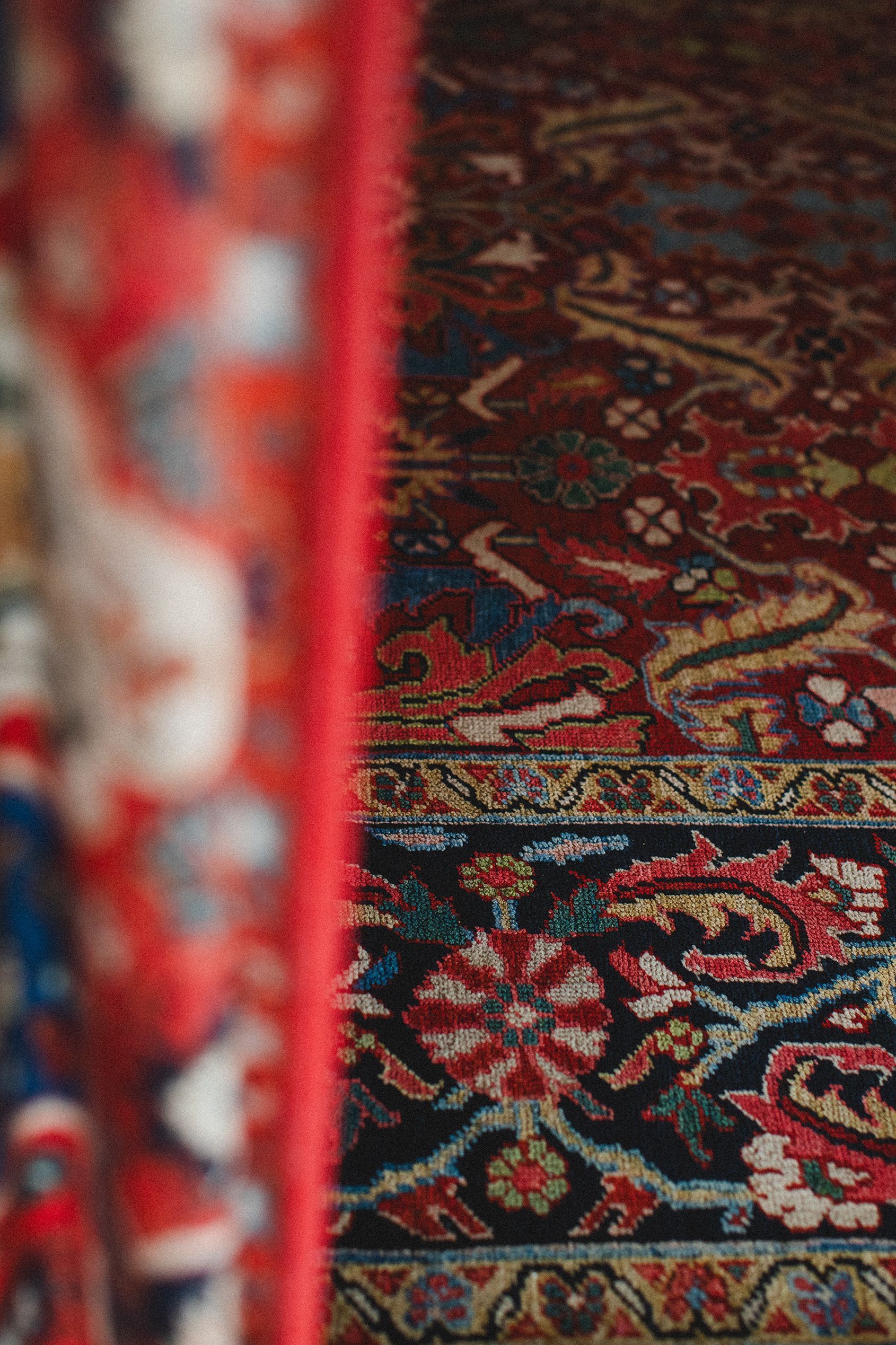 A close up of a rug with a floral pattern on it.