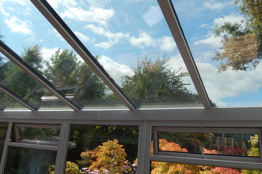 Photo showing a glass conservatory roof with panels of self-cleaning glass.