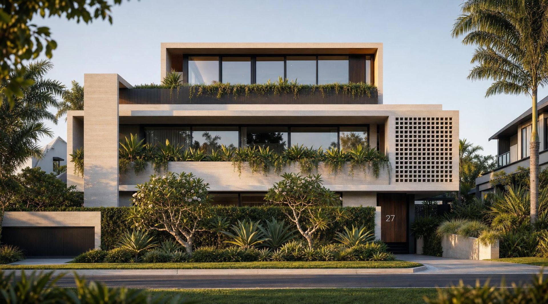 Modern three-story house with white facade, rooftop greenery, and large balconies behind trees