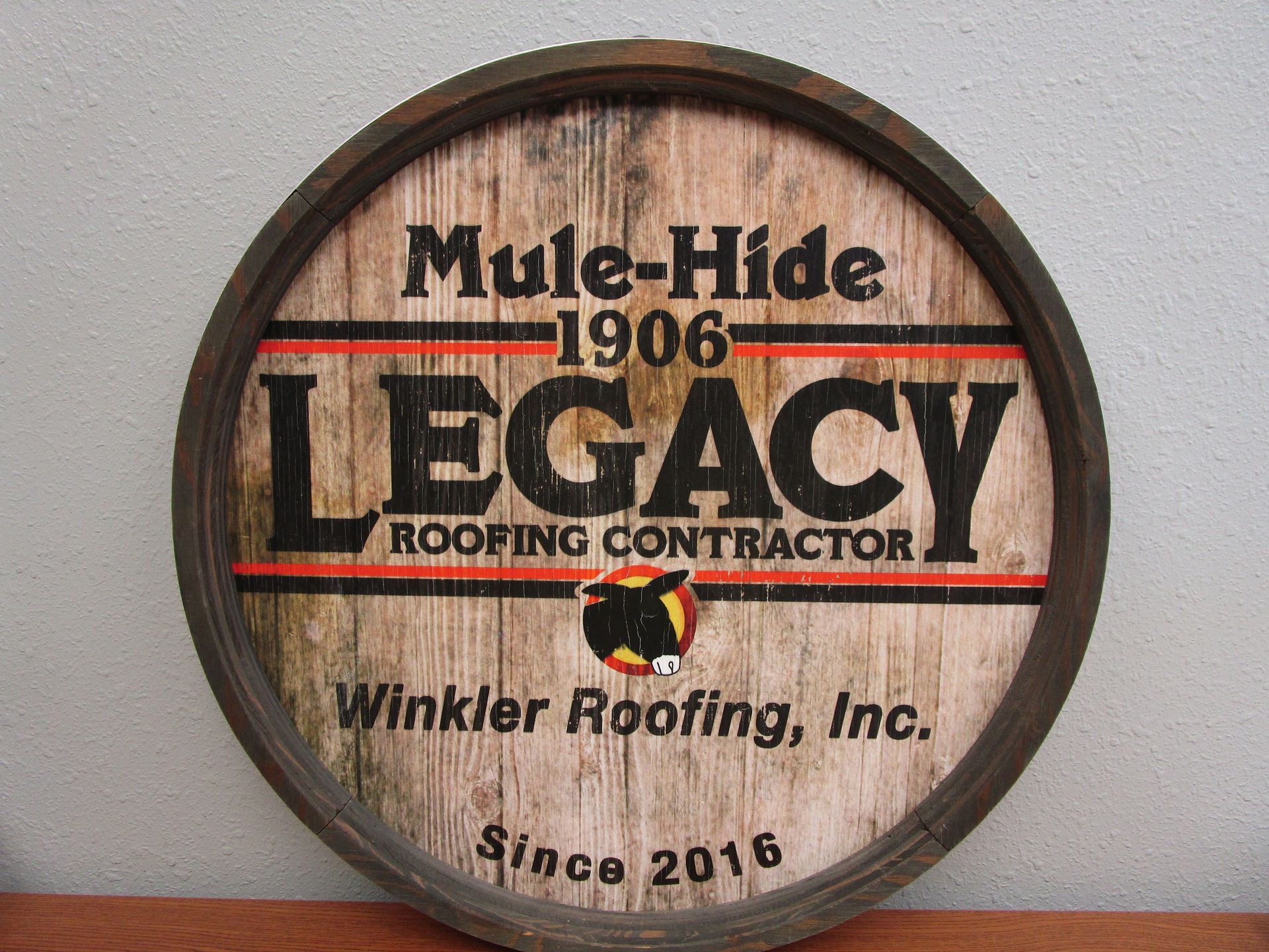 A mule-hide 1906 legacy roofing contractor sign