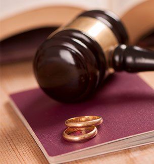 Divorce Lawyer — Wedding Rings Near Gavel in Orlando, FL