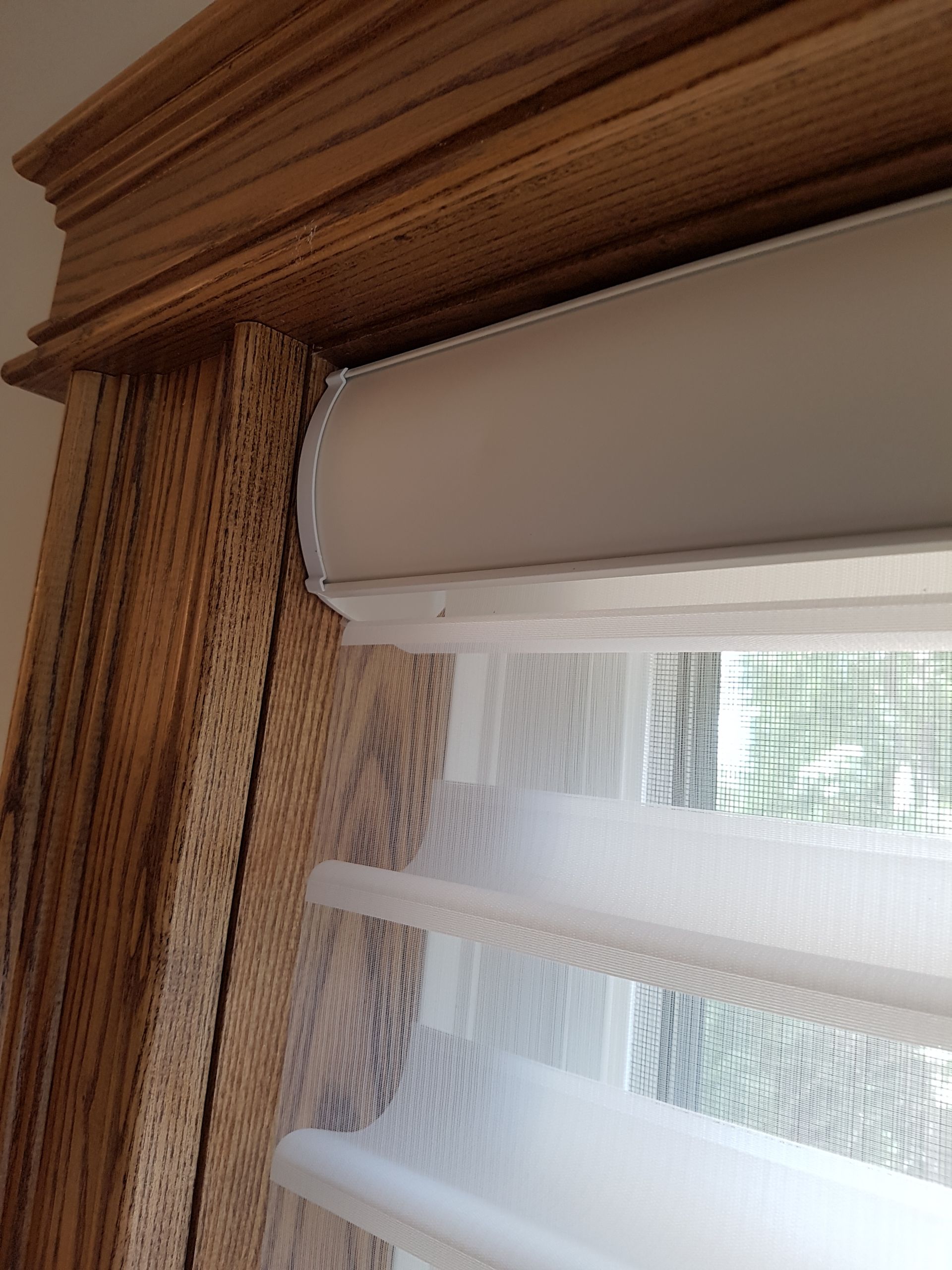 A close up of a window with blinds on it.