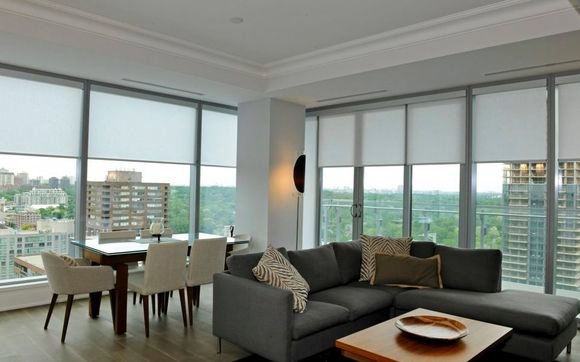 A living room with a couch a table and chairs