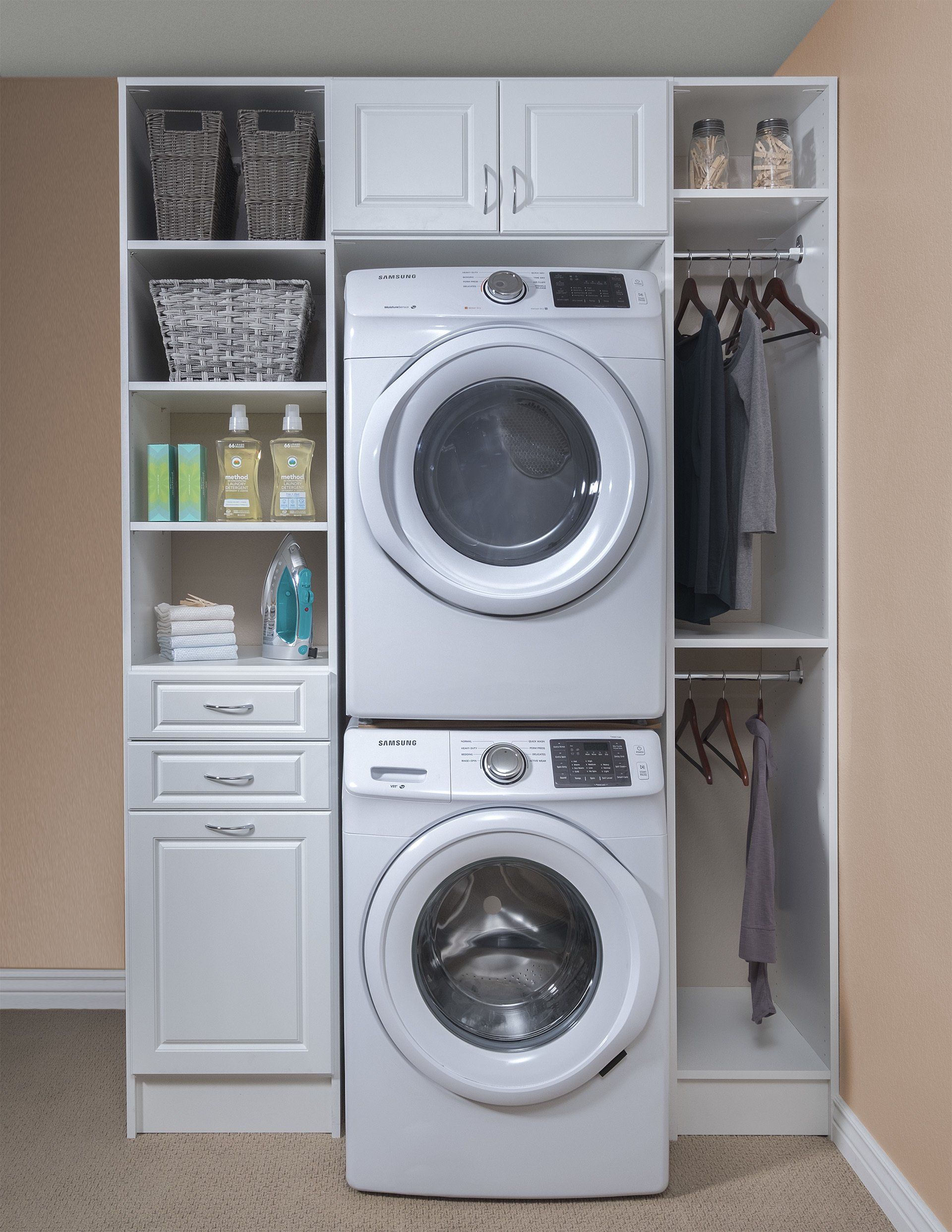 A washer and dryer are stacked on top of each other in a laundry room