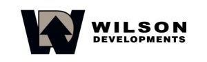 A wilson developments logo on a black background