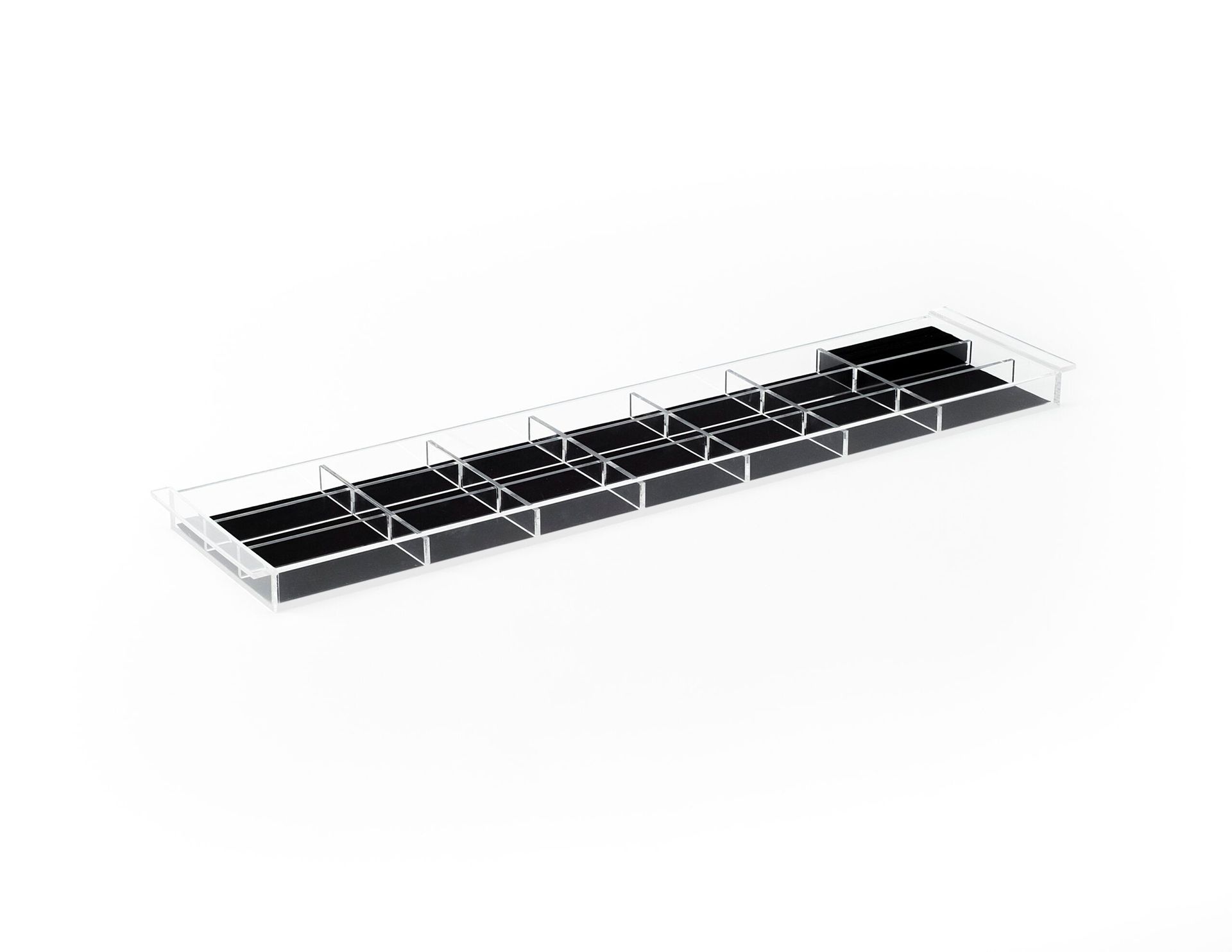 A black and white acrylic tray with dividers on a white background.