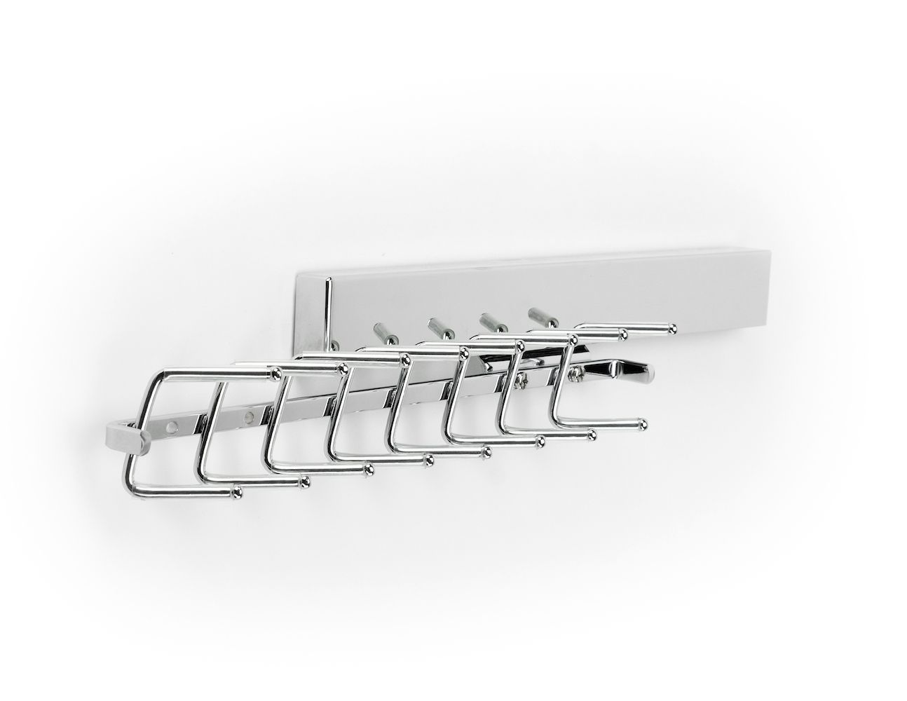 A white wall mounted coat rack with a bunch of hooks on it.