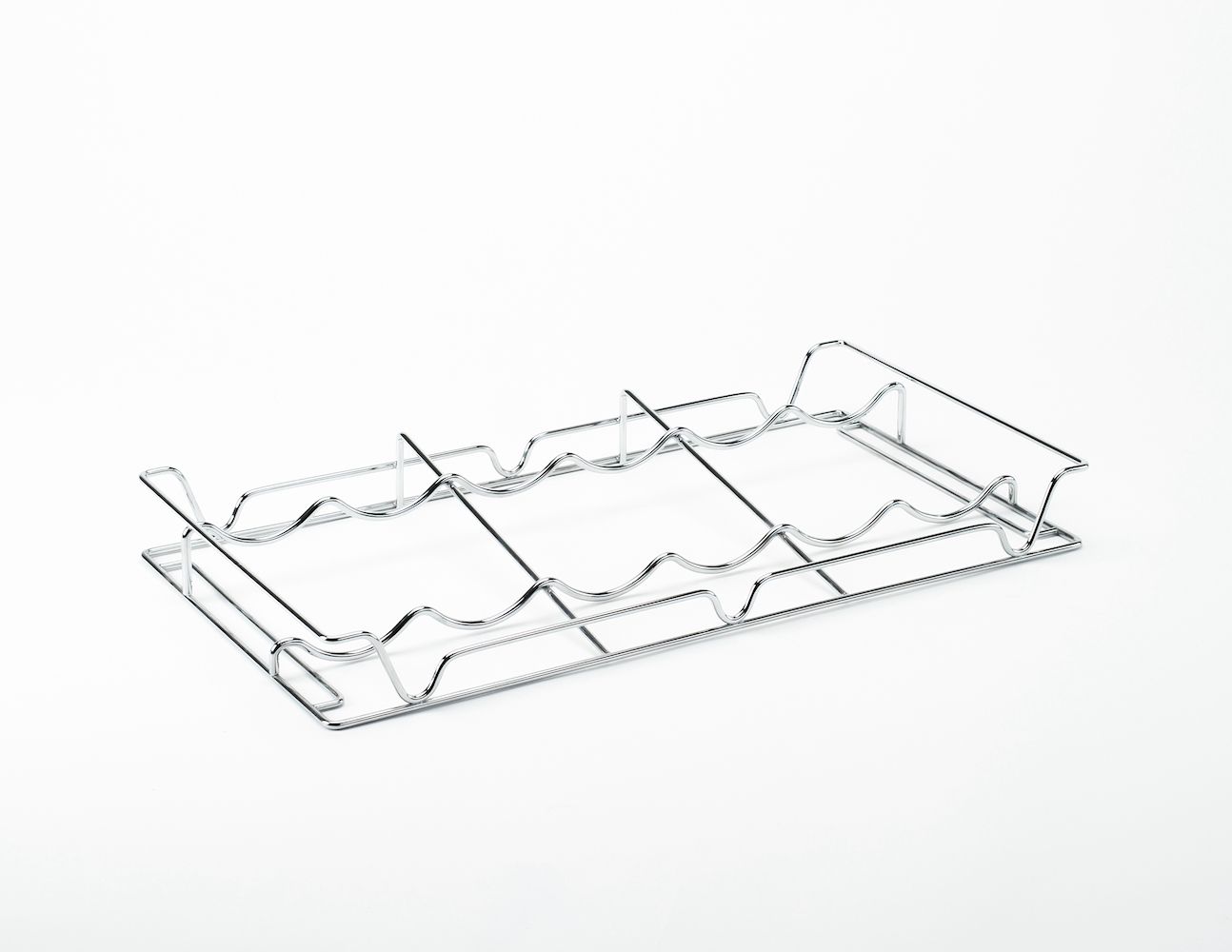 A metal tray with a handle on a white surface.
