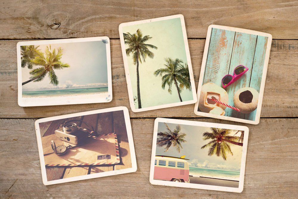 Postcards On Wooden Surface — Printing Services in Coffs Harbour, NSW