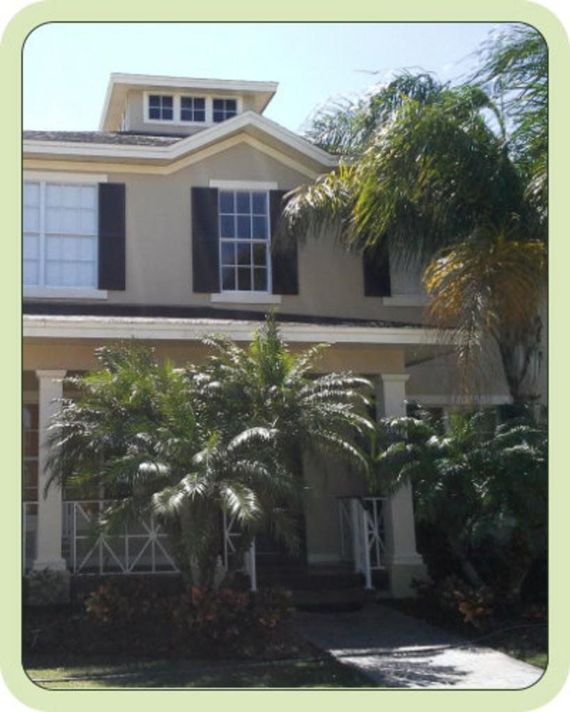 exterior of a house with palm trees