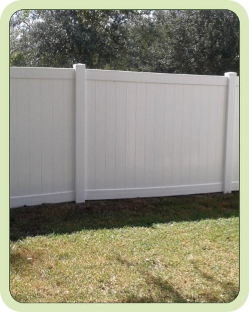 Clean wooden white fence after pressure washing
