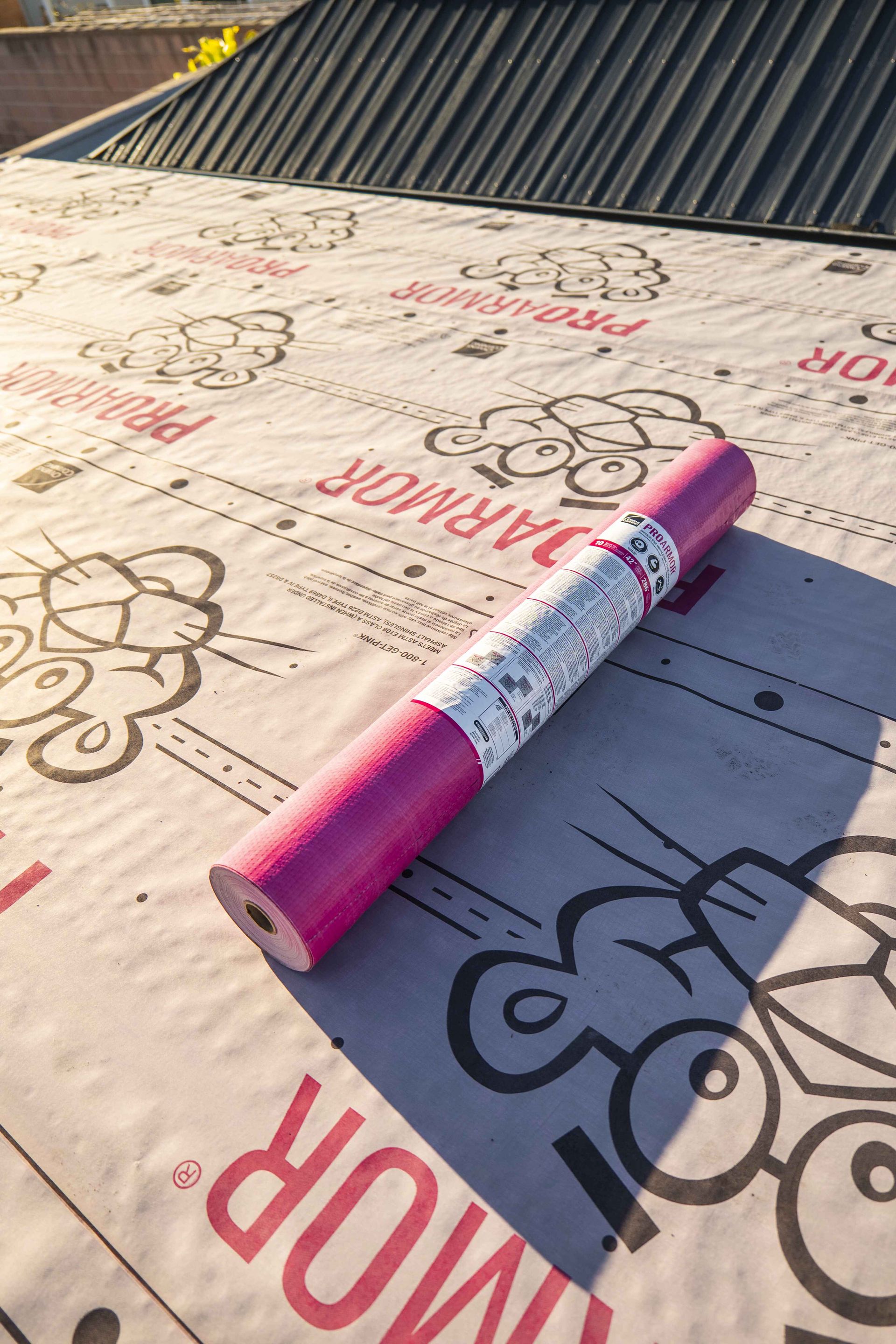 A man is installing a solar panel on a roof