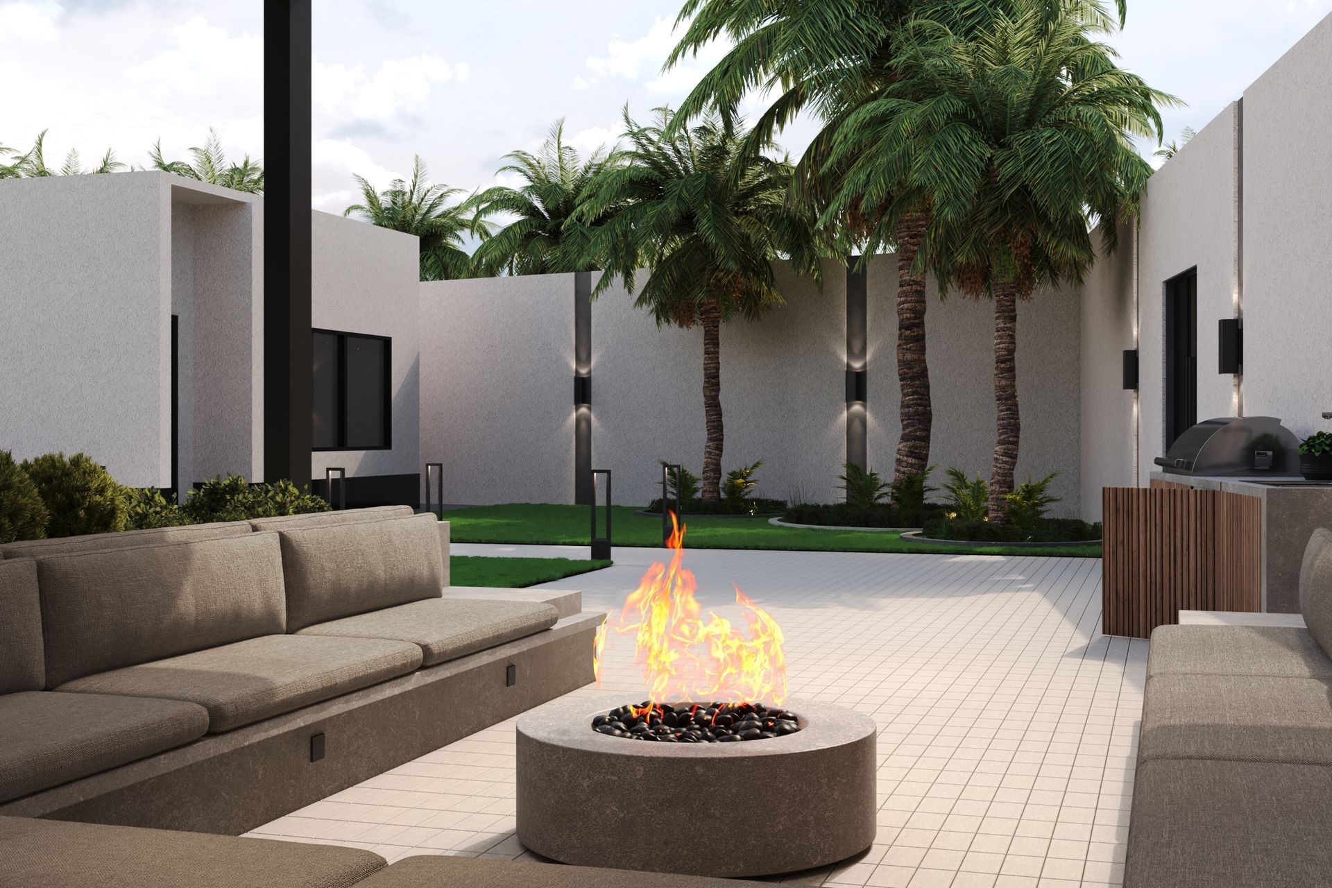 Outdoor patio with a fire pit, gray couches, and palm trees.